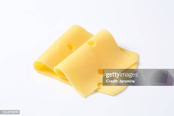 piegato fette di formaggio - swiss cheese foto e immagini stock