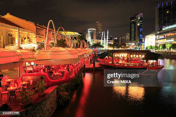 night view of clarke quay, singapore - singapore river stock-fotos und bilder