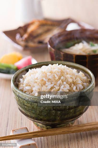 steamed brown rice with side dishes - rice bowl stock pictures, royalty-free photos & images