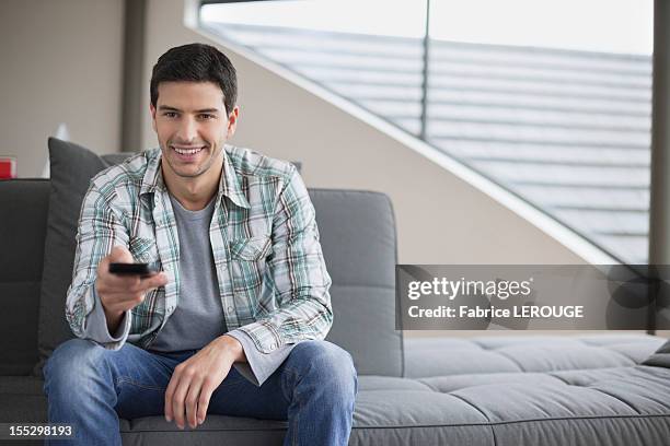 Man Using Remote 19,691 Guy Holding Remote Stock Photos, High-Res Pictures, and Images ...