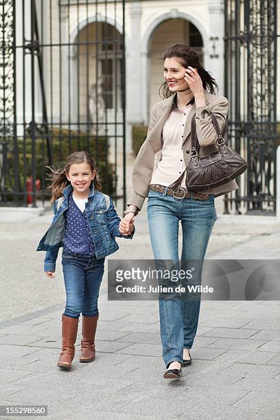 portrait of a girl walking with her mother - farewell in 2012 stock pictures, royalty-free photos & images