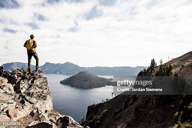 hiking around crater lake in oregon. - oregon mountains stock pictures, royalty-free photos & images