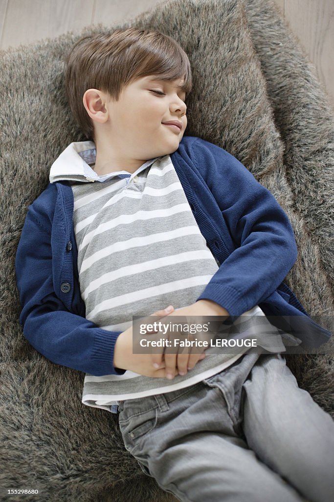 High angle view of a boy sleeping