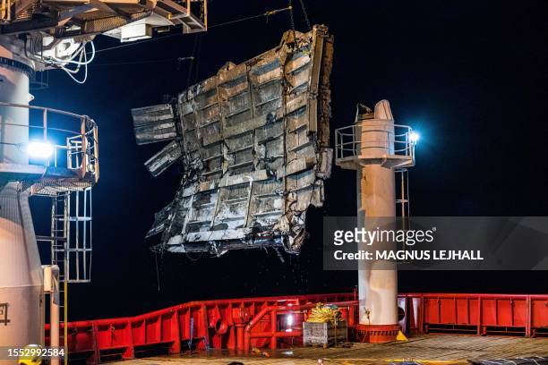 Part of a bow ramp from the wreck Estonia is loaded on board the Viking Reach ship, at the site of the sinking of cruiseferry MS Estonia in the...