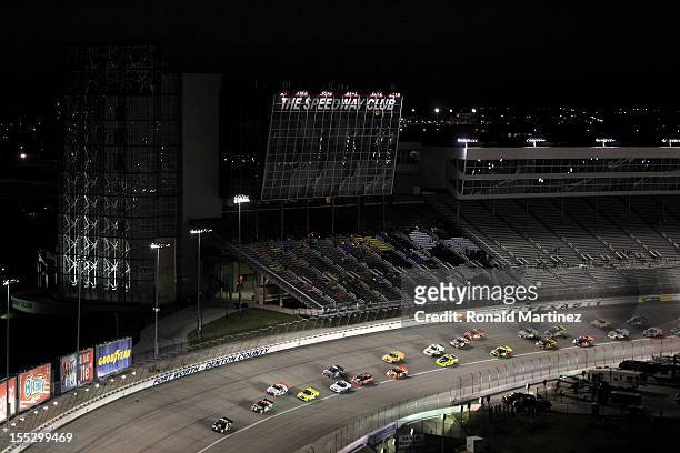 Nelson Piquet Jr., driver of the TAG Heuer Avant-Garde Eyewear Chevrolet, leads the field during the NASCAR Camping World Truck Series WinStar World...