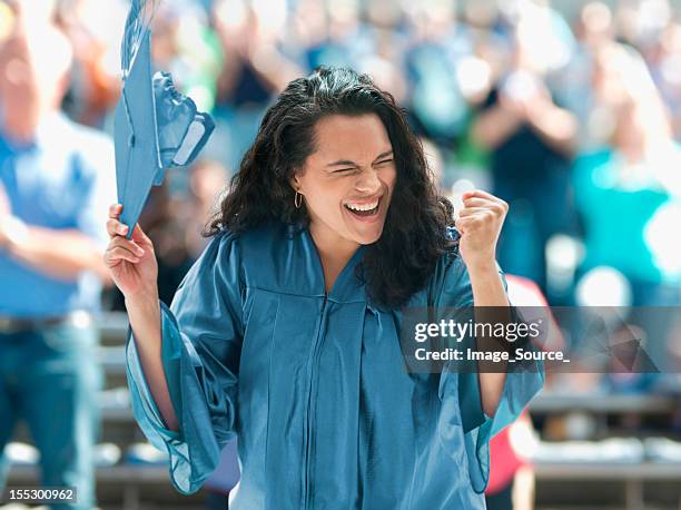 overjoyed female graduate - graduation excitement stock pictures, royalty-free photos & images