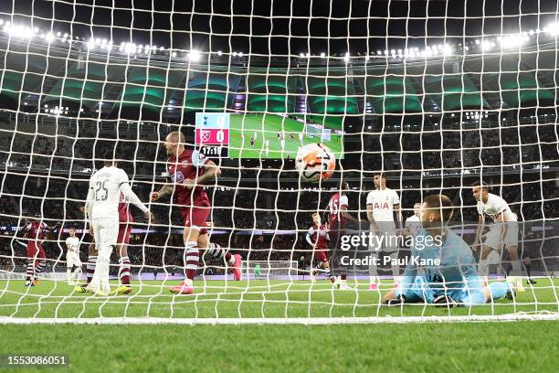 Guglielmo Vicario of Hotspur looks on after Danny Ings of West Ham scores a goal during the pre-season friendly match between Tottenham Hotspur and...