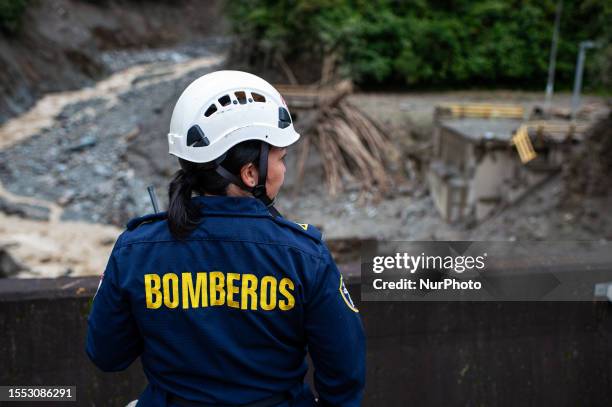 Firefighter oversees search operations at the landslide in Quetame, Cundinamarca, Colombia now confirms the death of 26 and 3 still missing, on July...