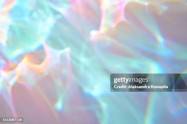 abstract ethereal rainbow light overlay effect, holographic light refraction - iridiscente fotografías e imágenes de stock