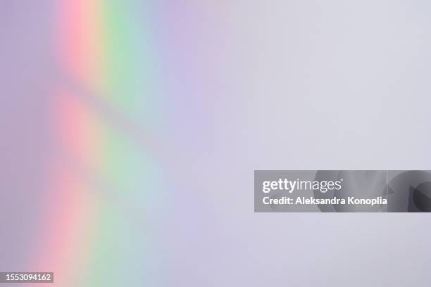 blurred spectrum rainbow light refraction texture overlay effect - rainbow lens flare stock pictures, royalty-free photos & images