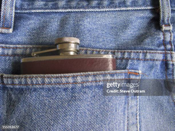 whisky flask in the back pocket of a pair of jeans - drinking flask stock pictures, royalty-free photos & images