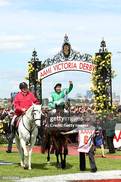 Damien Oliver riding Fiveandahalfstar celebrates winning the AAMI Victoria Derby on Victoria Derby Day at Flemington Racecourse on November 3, 2012...