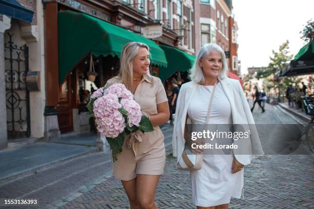 two beautiful female tourists in utrecht - utrecht stock pictures, royalty-free photos & images