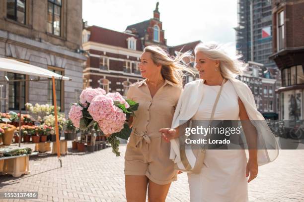two beautiful female tourists in utrecht - utrecht stock pictures, royalty-free photos & images