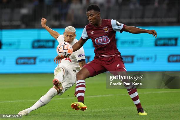 Richarlison of Hotspur shoots on goal against Levi Laing of West Ham during the pre-season friendly match between Tottenham Hotspur and West Ham...