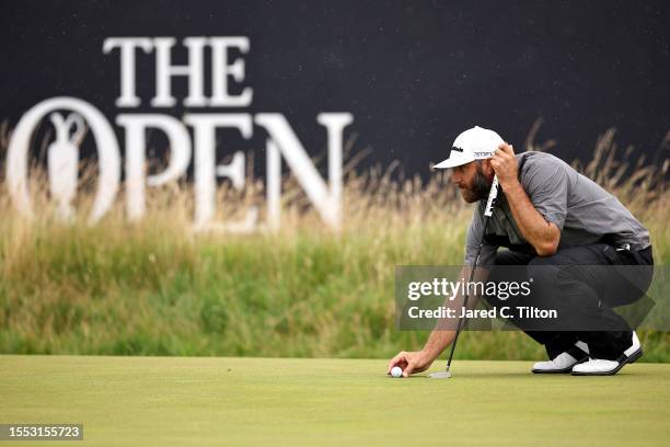 Dustin Johnson of the United States lines up a putt on the 3rd green during a practice round prior to The 151st Open at Royal Liverpool Golf Club on...