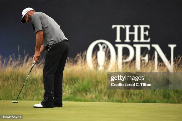 Dustin Johnson of the United States putts on the 3rd green during a practice round prior to The 151st Open at Royal Liverpool Golf Club on July 18,...