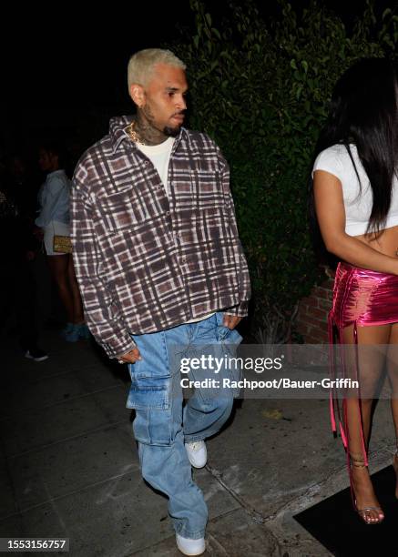 Chris Brown is seen arriving to Winnie Harlow's Birthday party at Delilah's restaurant West Restaurant on July 24, 2023 in Los Angeles, California.