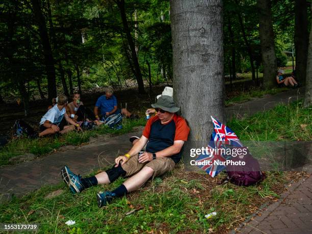 Participants are seen taking a break during the 105th edition of the International Four Days Marches held in Nijmegen, from July 18th to 21st, 2023.