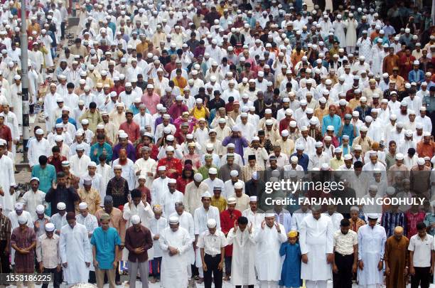 Bangladeshi Muslims offer "Eid al-Fitr" prayers outside the Baitul Mukarram National Mosque during the first day of their religious festival in Dhaka...