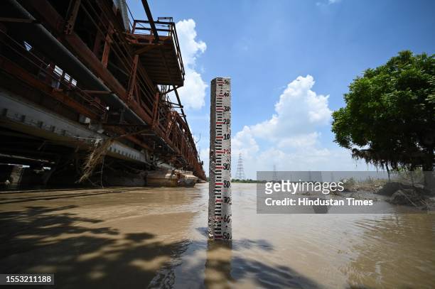 General view of rising water level of river Yamuna after heavy monsoon rains at Old Iron Bridge on July 24, 2023 in New Delhi, India.