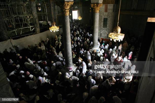 Palestinian Muslim women pray at Dome of the Rock mosque, at the Al-Aqsa mosque compound in the city's old city, on the first Friday noon prayer of...