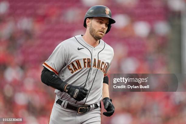 Austin Slater of the San Francisco Giants rounds the bases after hitting a home run in the third inning against the Cincinnati Reds at Great American...