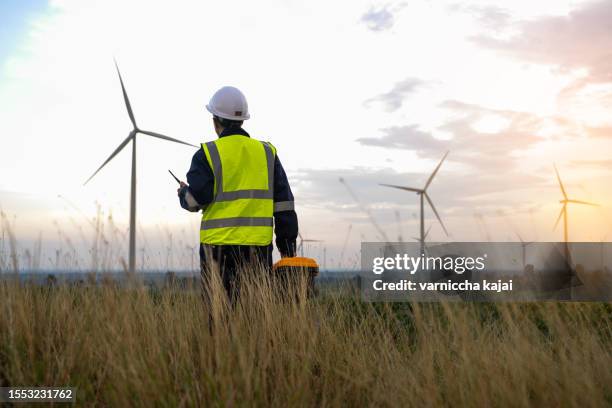male engineer planning on wind turbine maintenance work, nature renewable energy concept, wind power - wind turbine california stock pictures, royalty-free photos & images