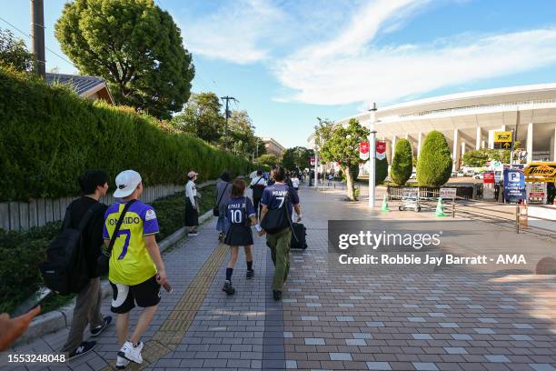 Japanese fans of Al Nassr and PSG make their way to the Yanmar Stadium Nagai wearing Cristiano Ronaldo of Al Nassr, Neymar and Kylian Mbappe of PSG...