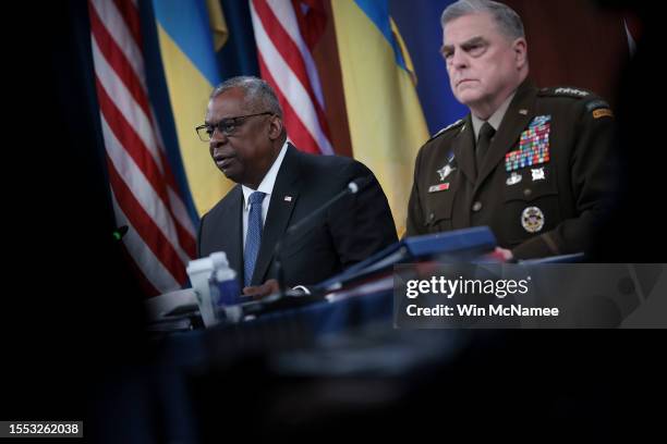 Secretary of Defense Lloyd Austin and Chairman of the Joint Chiefs of Staff General Mark MIlley participate virtually in a meeting of the Ukraine...