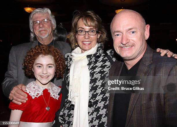Annie composer Martin Charnin, Lilla Crawford as "Annie", Gabrielle Giffords and husband Mark E. Kelly pose backstage at the hit revival of "Annie"...