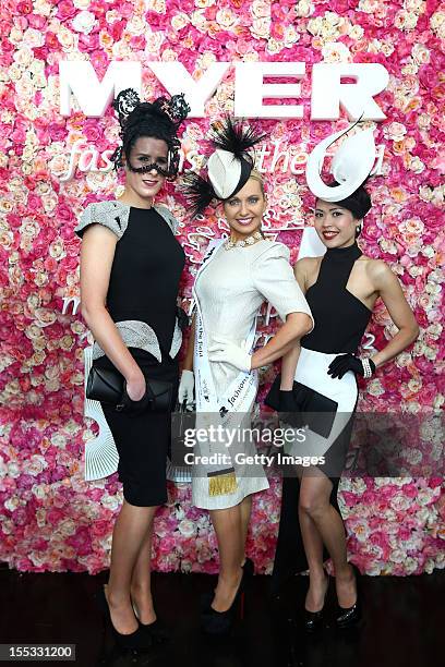 Myer Fashions on the Field Women's Racewear daily finalists, Lisa Wellings, Emma Gooding, and Elise Crews pose on AAMI Victoria Derby Day at...