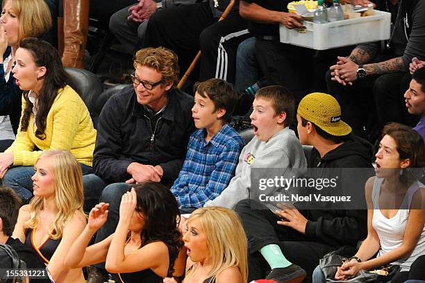 Simon Baker and his son Claude Blue attend a basketball game between the Los Angeles Clippers and the Los Angeles Lakers at Staples Center on...