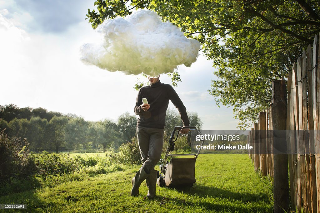 Man working 'in the cloud' with a smart phone