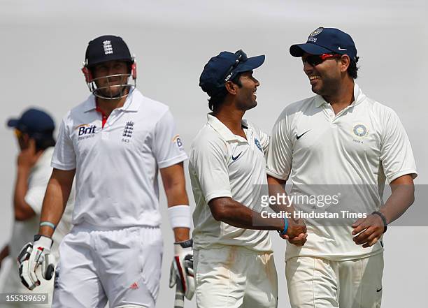 Yuvraj Singh of India 'A' is congratulated by teammate Ashok Dinda as the prior claims the wicket of Tim Bresnen as they walk back to the pavilion...