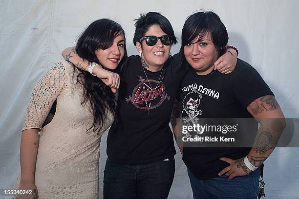 Musicians Nina Diaz, Jenn Alva, and Phanie Diaz of Girl in a Coma pose backstage during day one of Fun Fun Fun Fest at Auditorium Shores on November...