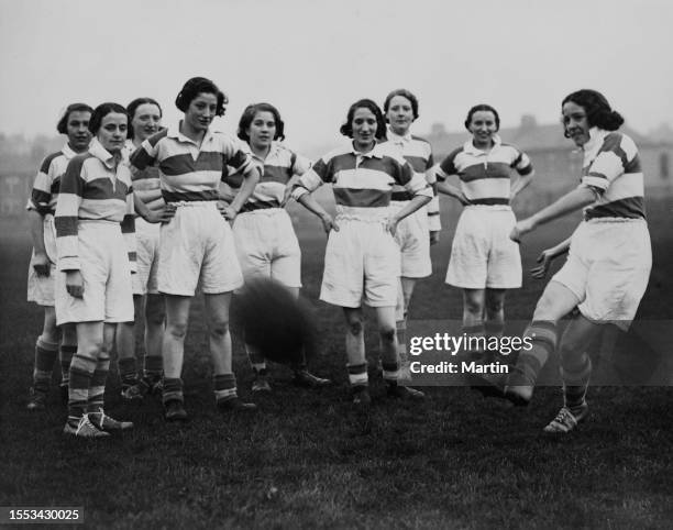 Players of Edinburgh City Girls' football club, wearing kits comprising hooped shirts and white shorts, during a training session in Edinburgh,...