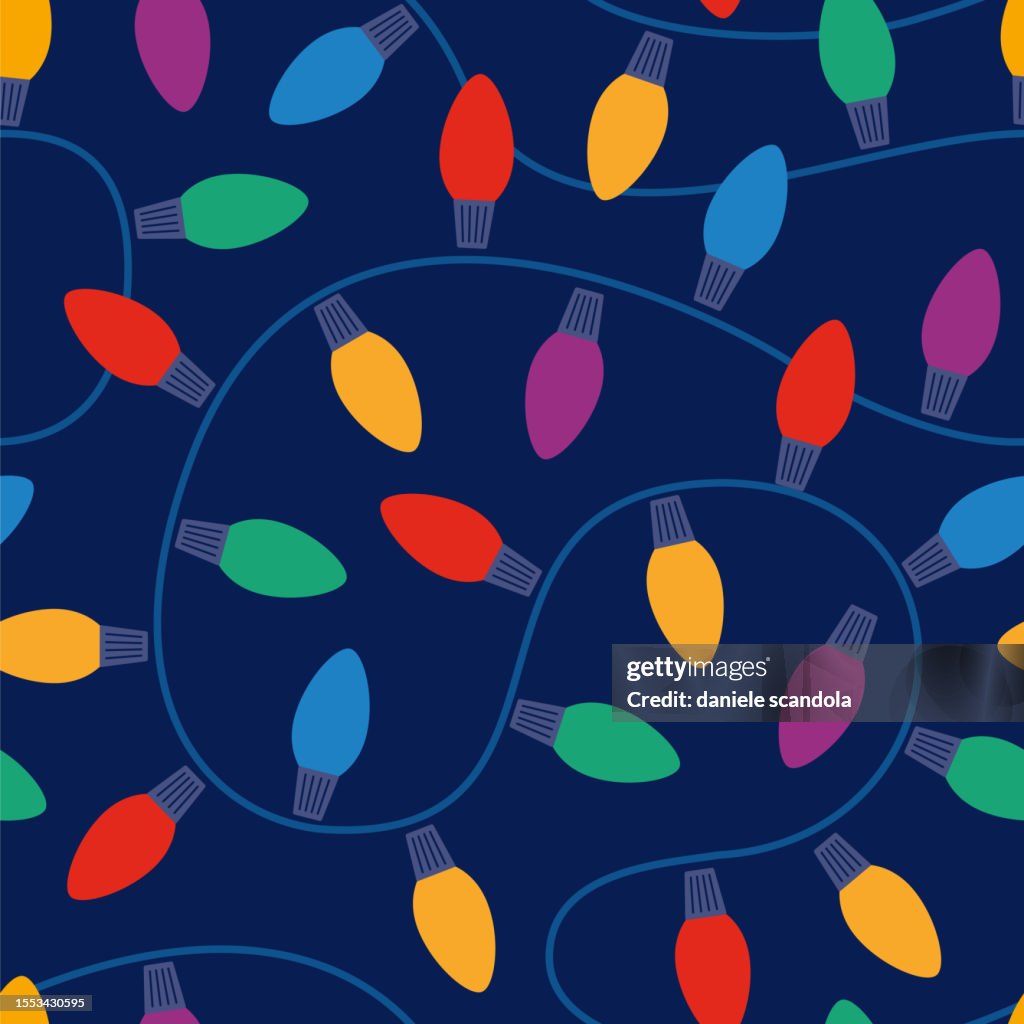 青の背景にクリスマスライトシームレスなパターン。