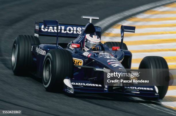 Jarno Trulli from Italy drives the Equipe Prost Gauloises Blondes Prost AP01 Peugeot V10 during the Formula One Brazilian Grand Prix on 29th March...