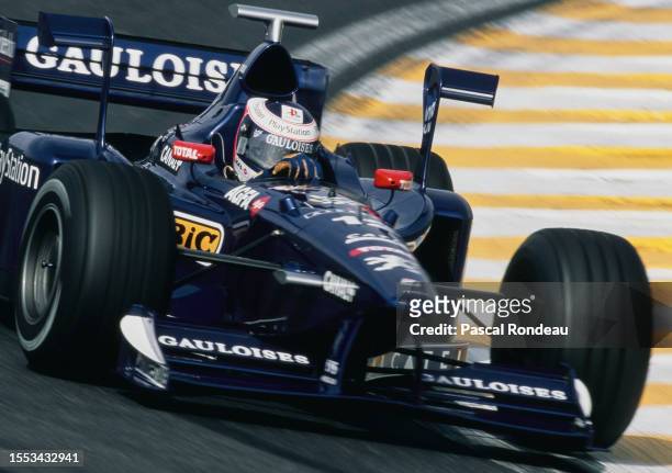 Jarno Trulli from Italy drives the Equipe Prost Gauloises Blondes Prost AP01 Peugeot V10 during the Formula One Brazilian Grand Prix on 29th March...