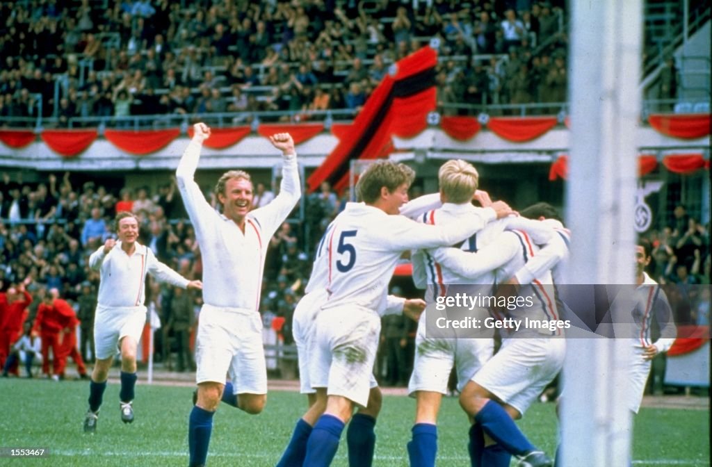 Michael Caine and England player Bobby Moore of the POW's