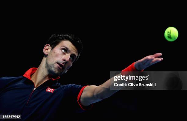Novak Djokovic of Serbia serves during a practice session prior to the start of ATP World Tour Finals Tennis at the O2 Arena on November 3, 2012 in...
