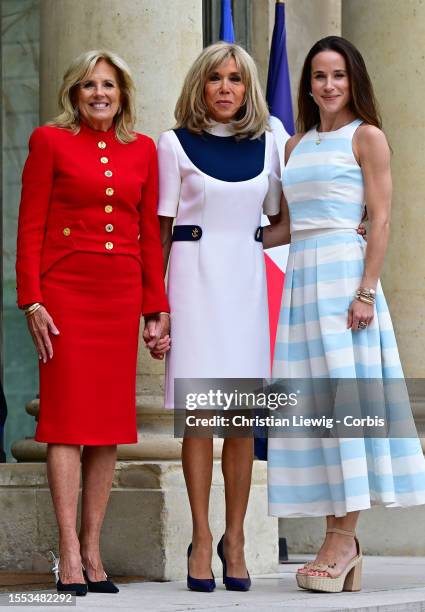 France's first lady Brigitte Macron poses with US First Lady Jill Biden and her daughter Ashley Biden as they meet at the Elysee Presidential Palace...