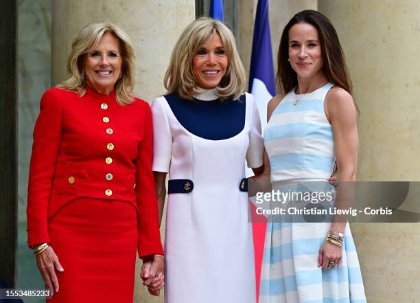 France's first lady Brigitte Macron poses with US First Lady Jill Biden and her daughter Ashley Biden as they meet at the Elysee Presidential Palace...