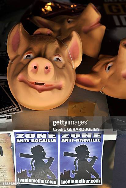 Pig masks are sold in a stand at the opening of a two-day convention of the French far-right organization Bloc Identitaire , on November 3, 2012 at...
