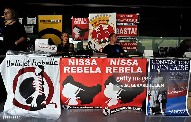 People sit in a stand at the opening of a two-day convention of the French far-right organization Bloc Identitaire , on November 3, 2012 at the...