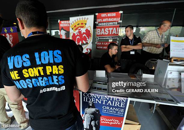 People attend a two-day convention of the French far-right organization Bloc Identitaire , on November 3, 2012 at the Palais des Princes in Orange,...