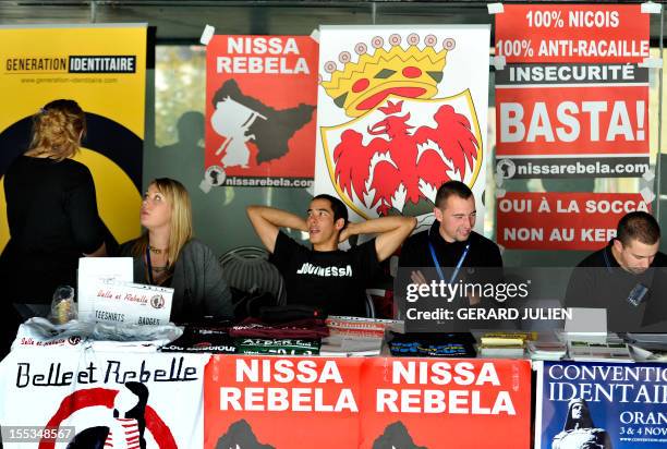 People sit in a stand at the opening of a two-day convention of the French far-right organization Bloc Identitaire , on November 3, 2012 at the...