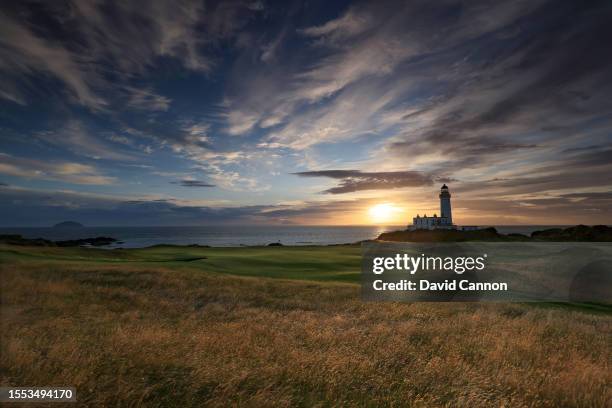 View of the green on the par 3, ninth hole beside The Turnberry Lighthouse as sunset on the Ailsa golf course at Trump Turnberry resort on July 09,...