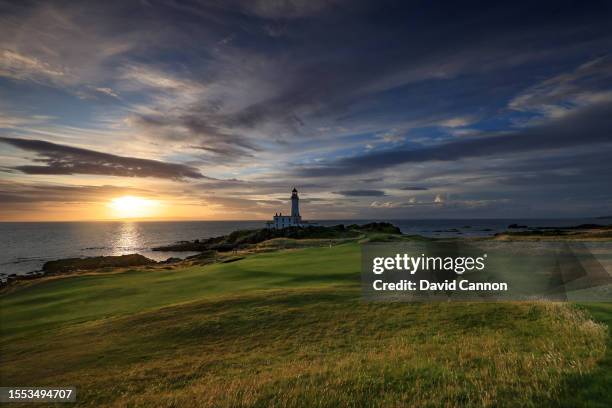 View of the green on the par 3, ninth hole beside The Turnberry Lighthouse as sunset on the Ailsa golf course at Trump Turnberry resort on July 09,...